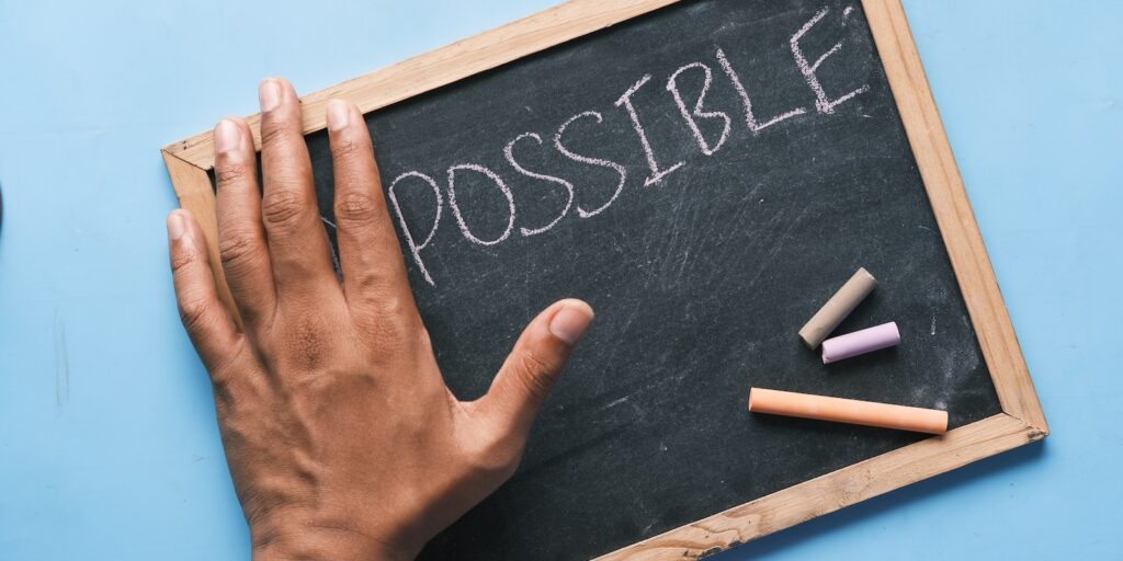 challenge, a chalkboard with the word possible written on it
