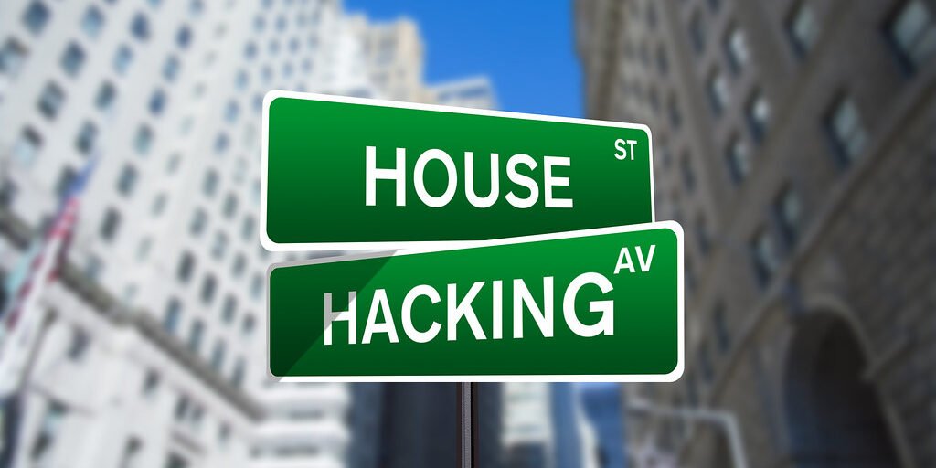House Hacking Street Sign On Wall Street